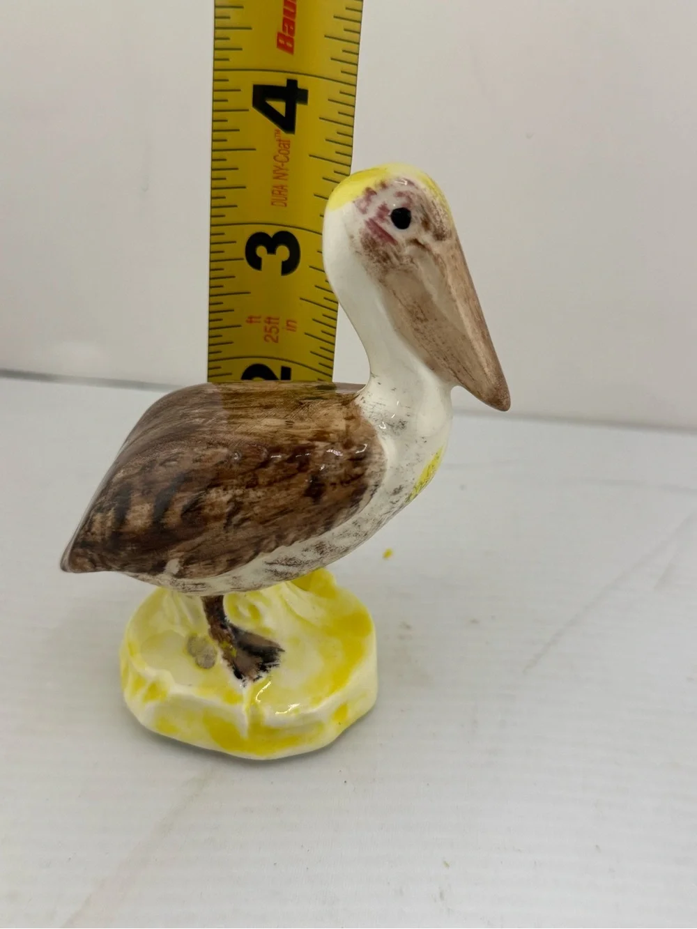 Vintage ceramic brown pelican figurine,